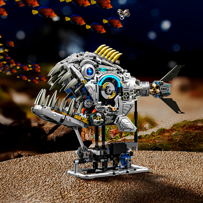 Maqueta 3D mecanizada de piraña con 1085 piezas, equipada con luces y mecanismo de manivela que permite movimiento dinámico.