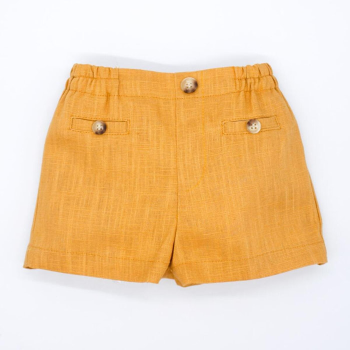 Bermuda de lino mostaza. Bolsillos falsos y botones, cintura elastica.