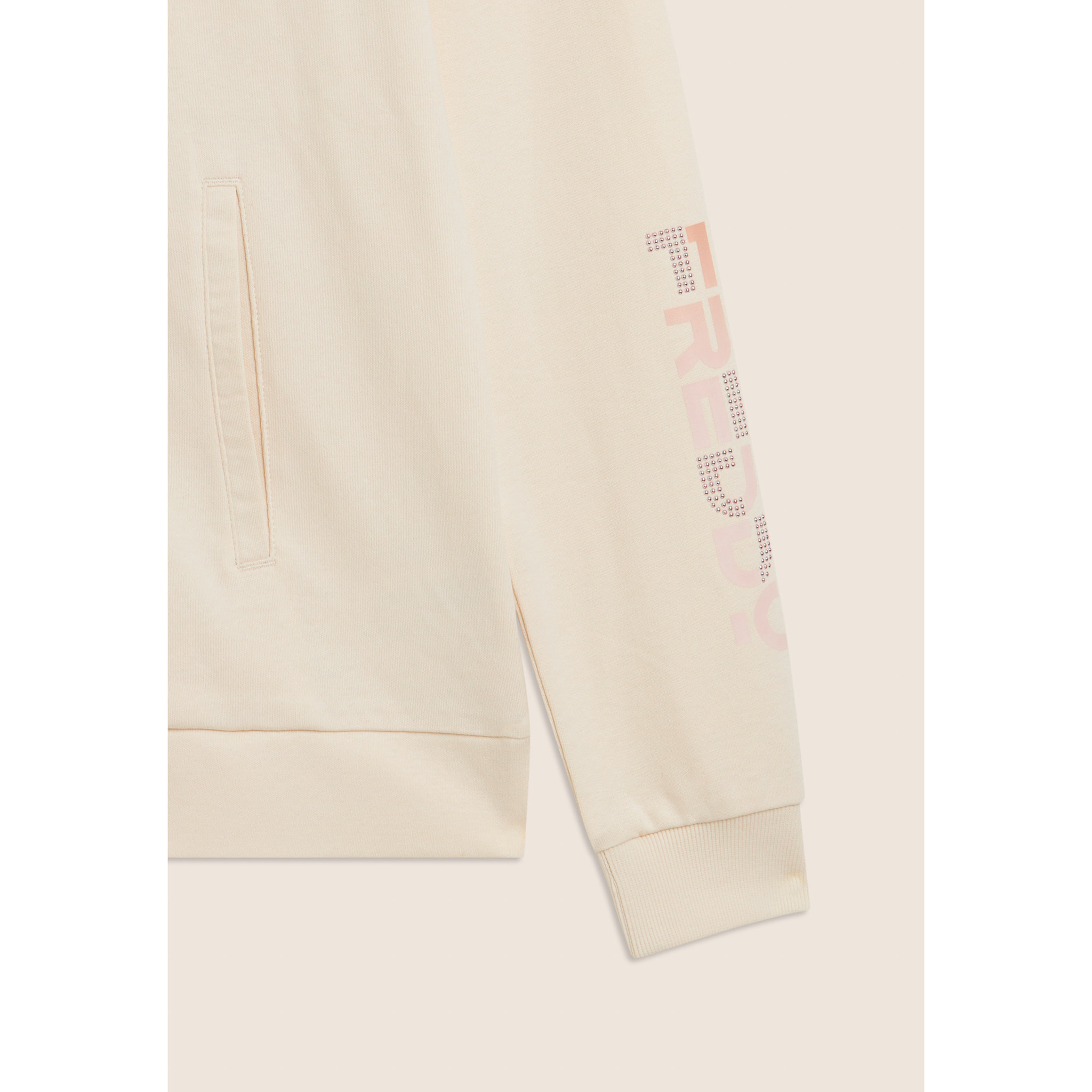 Tuta con zip e collo alto, logo con perline sulla manica