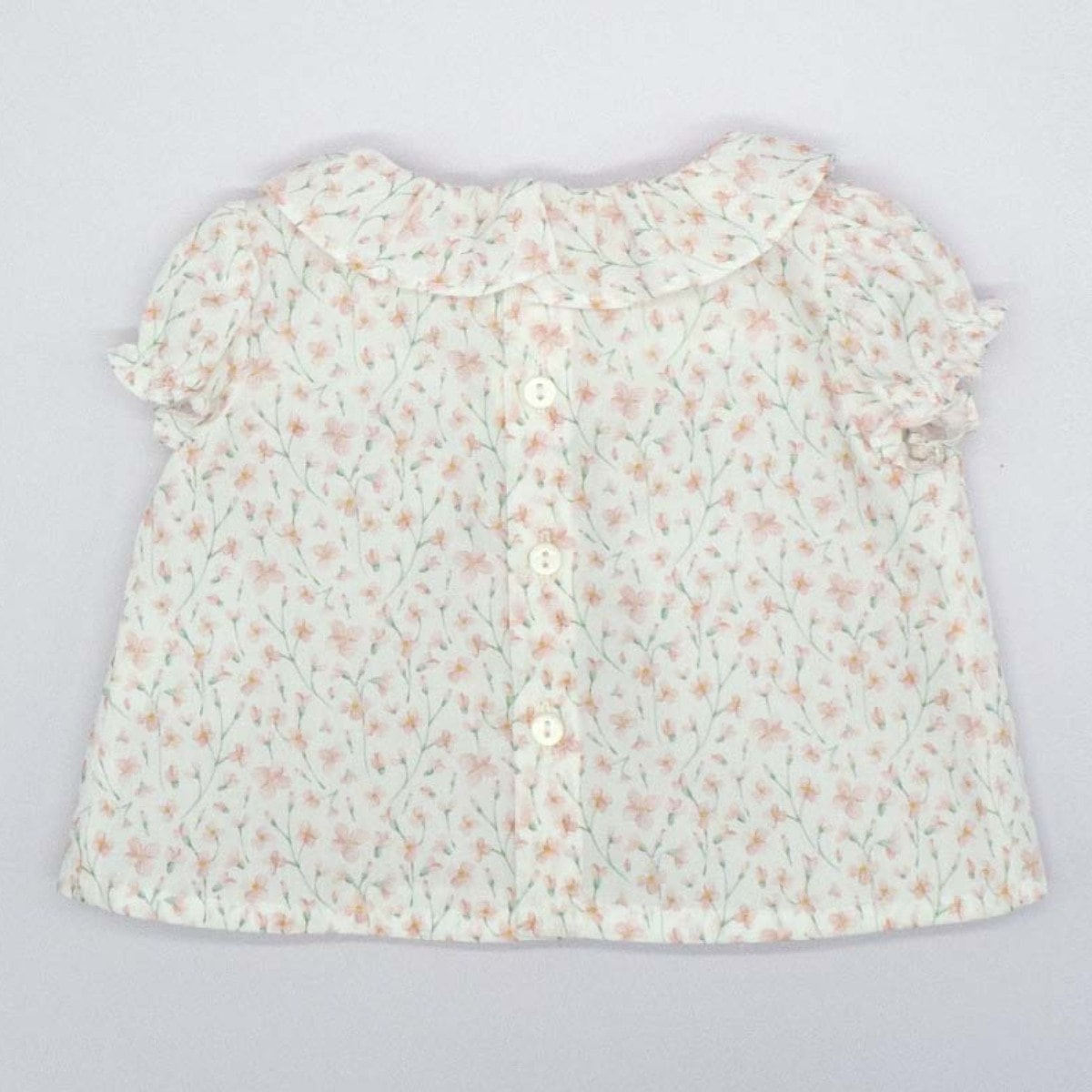 BLUSA CON CUELLO VOLANTE FLOR ROSA