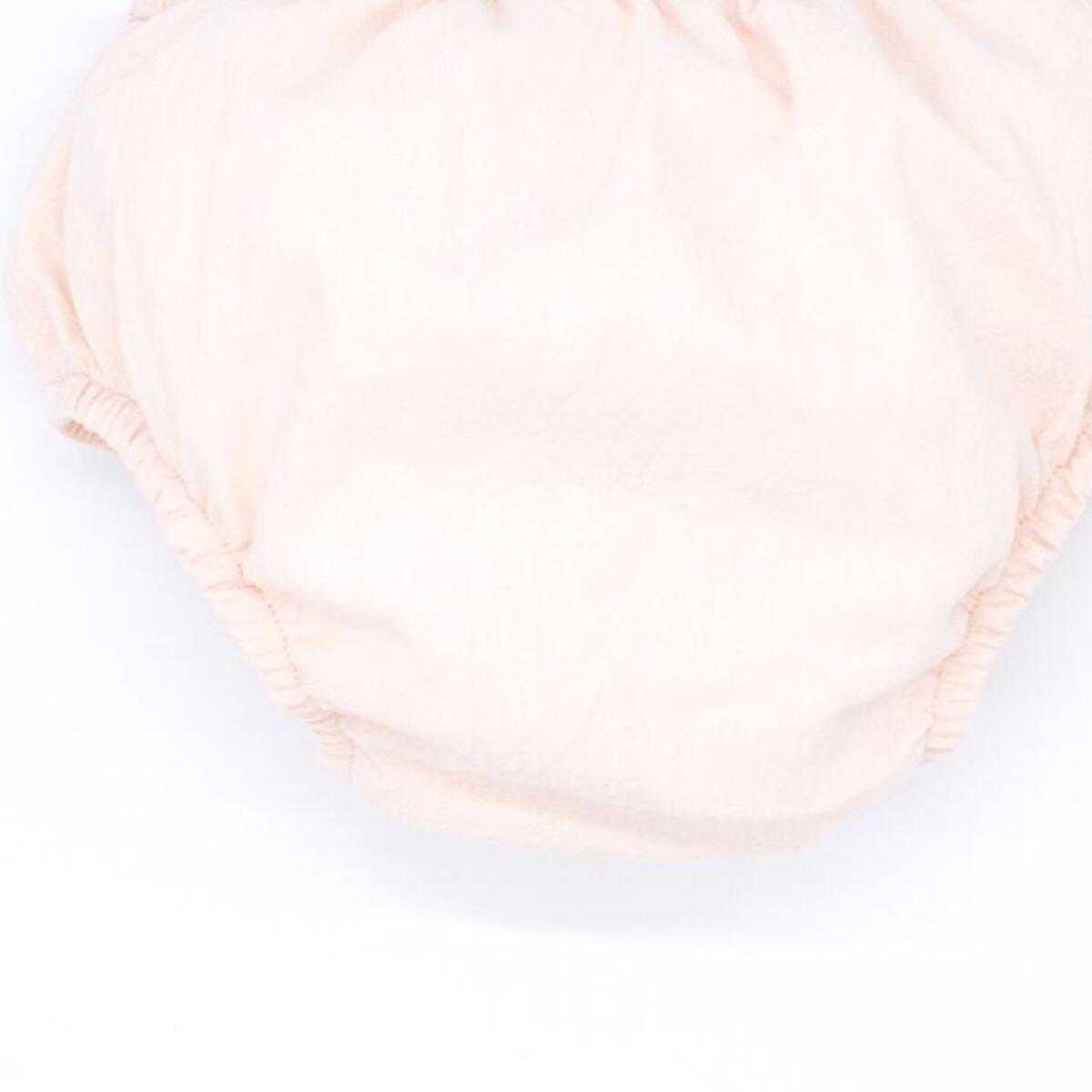 Cubrepañal de lino rosa. Elastico en la cintura y en las piernas.