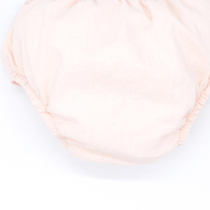 Cubrepañal de lino rosa. Elastico en la cintura y en las piernas.