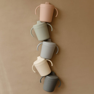 Mushie Taza Didáctica Con Asas Solid