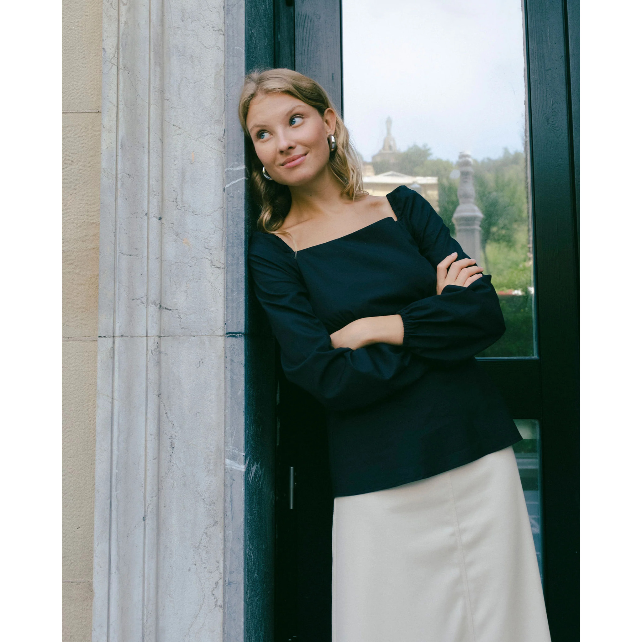 Blusa manga larga con lazadas en la espalda