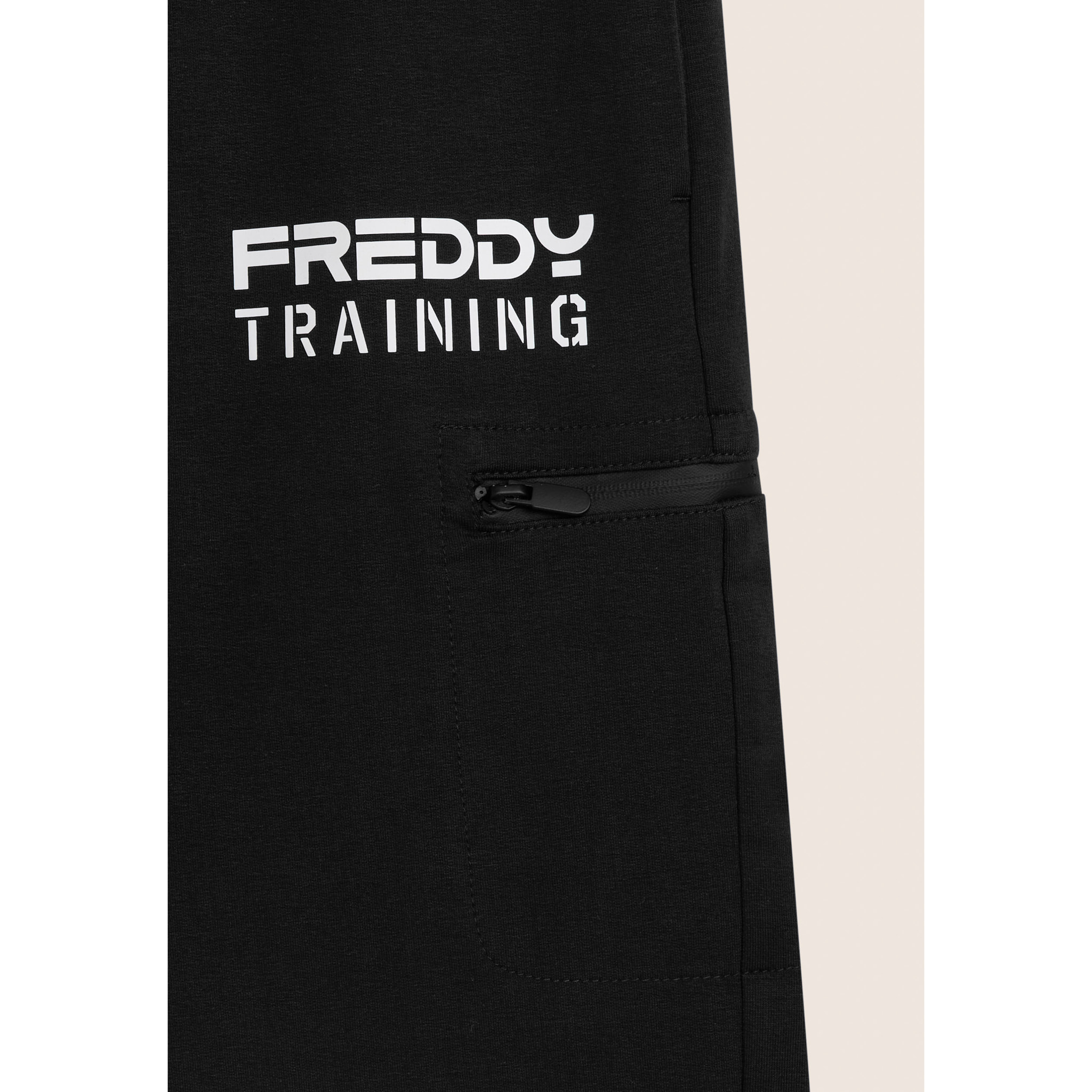 Shorts con stampa "TRAINING" e tasca zip