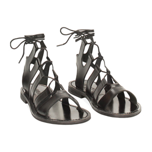 Sandalias planas negras de piel vacuna