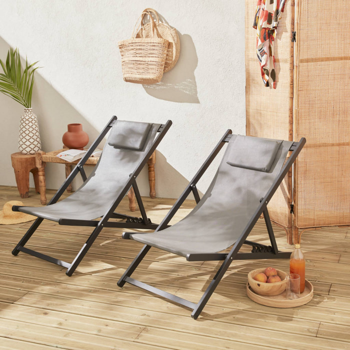 Lot de 2 bains de soleil - Gaia gris - Transat en aluminium gris anthracite et textilene gris avec coussin repose tête. chilienne
