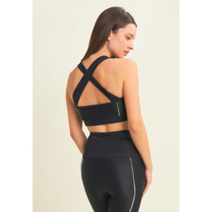 Top tecnico con spalline incrociate e profili bianchi