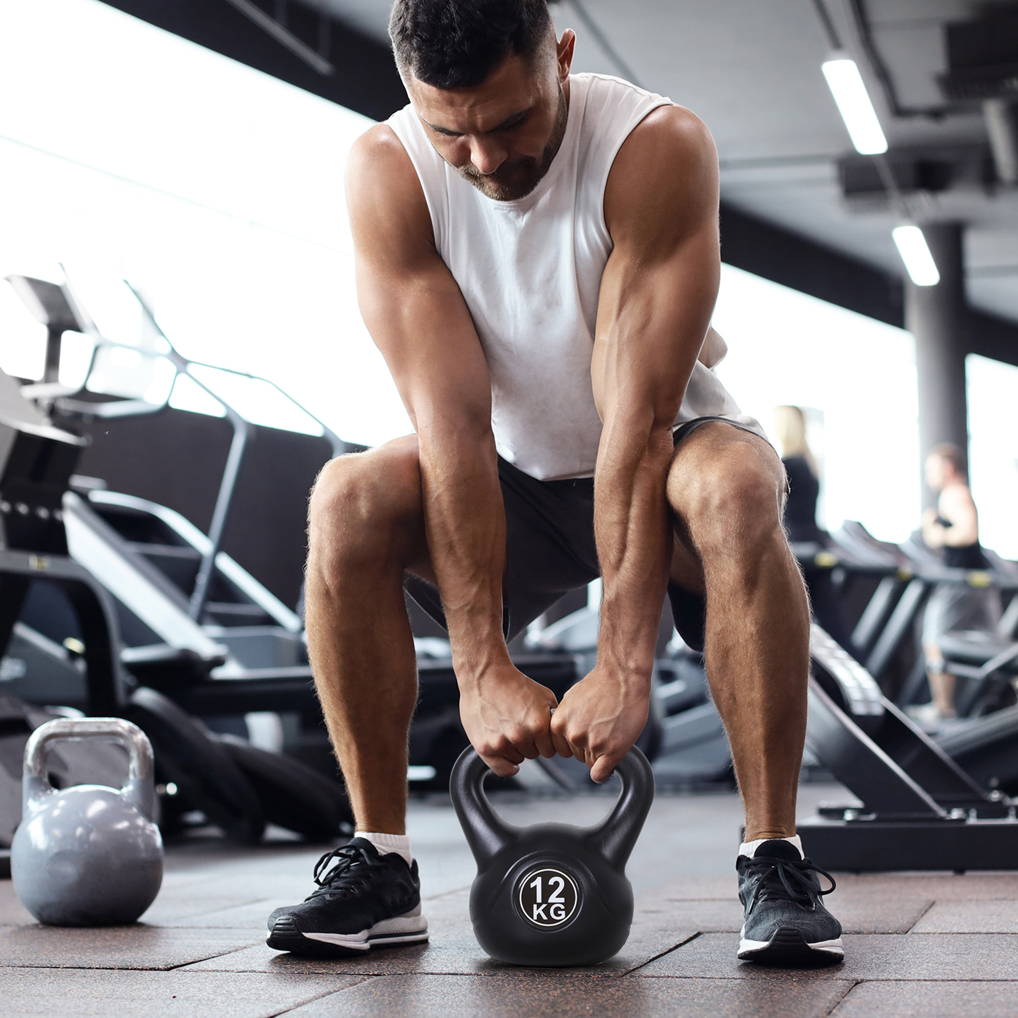 Kettlebell 12 Kg - haltère boule - poignée ergonomique - PVC noir