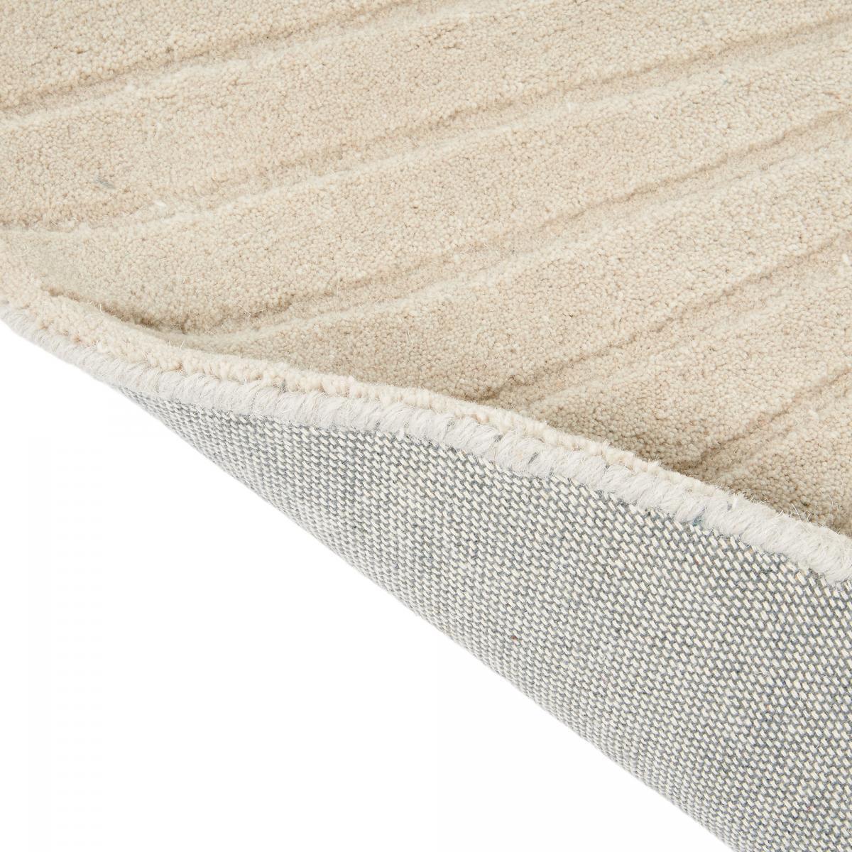 Tapis rond fait à la main en laine motif faux uni QUITA