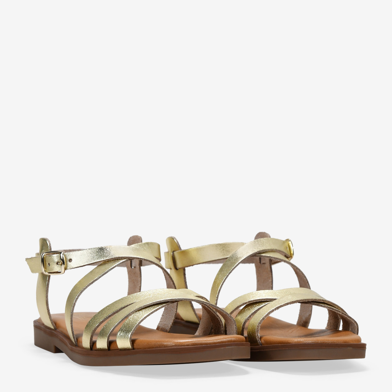 Sandalias planas doradas en piel con hebilla