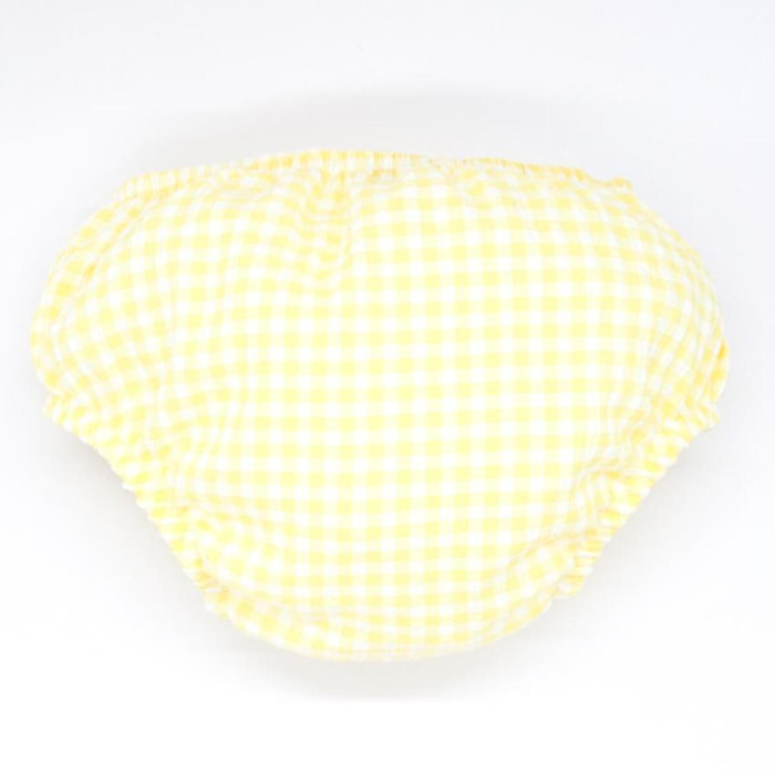 Cubrepañal de vichy amarillo. Elastico en la cintura y en las piernas.