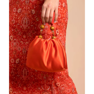Bolso de mano con asa de piedras