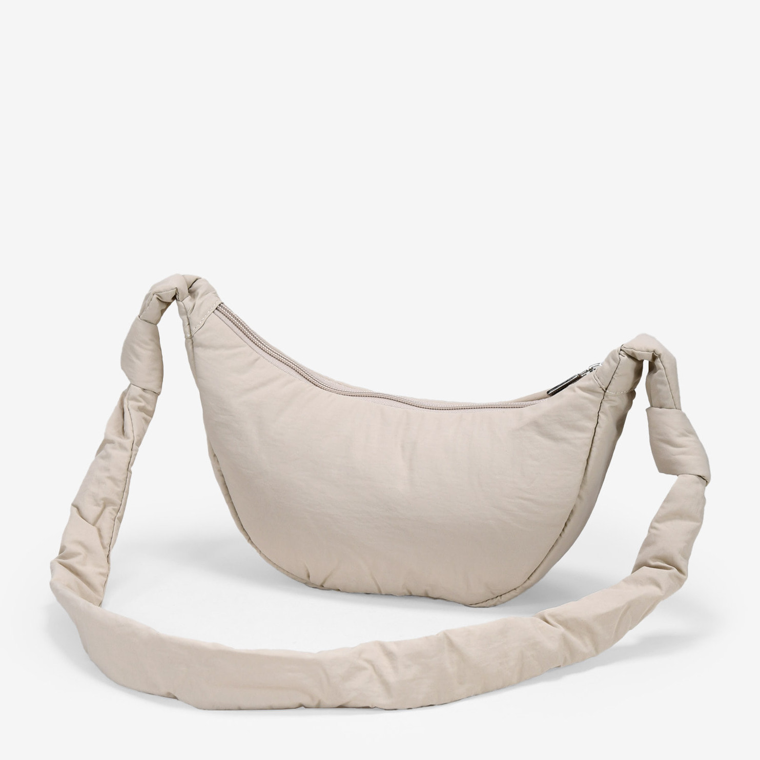 Bolso bandolera beige redondeado con cremallera