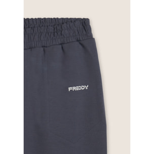 Pantaloni slim in interlock con dettagli lucidi