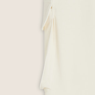 Gonna longuette con spacchi laterali e maxi tasca