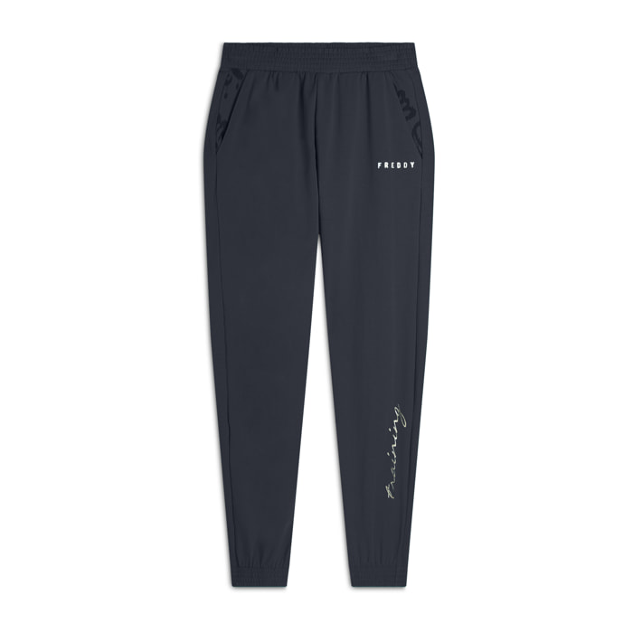 Pantaloni con elastico sul fondo e dettagli floreali