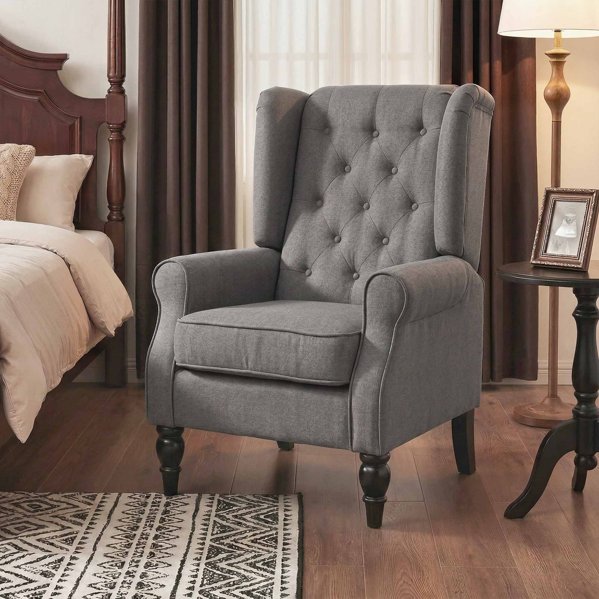 Fauteuil à oreilles style Chesterfield dossier capitonné grand confort bois noir tissu gris foncé