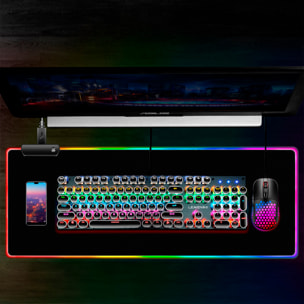 Alfombrilla gaming XXL con iluminación RGB, superficie antideslizante y conexión USB, ideal para teclado y ratón.