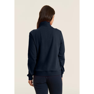 Tuta con zip e collo alto, logo in perline