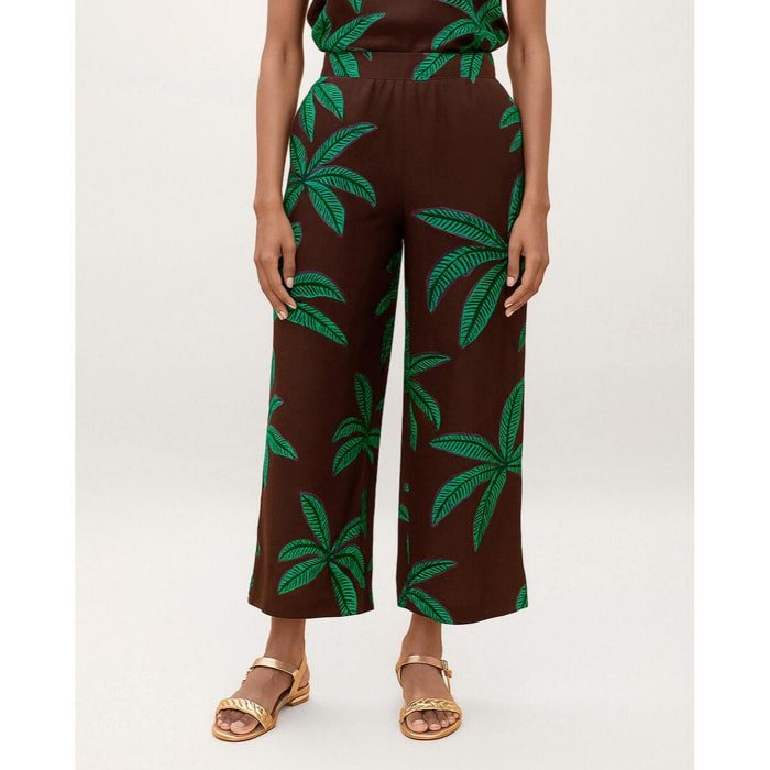 Pantaloni con sfondo marrone e palme