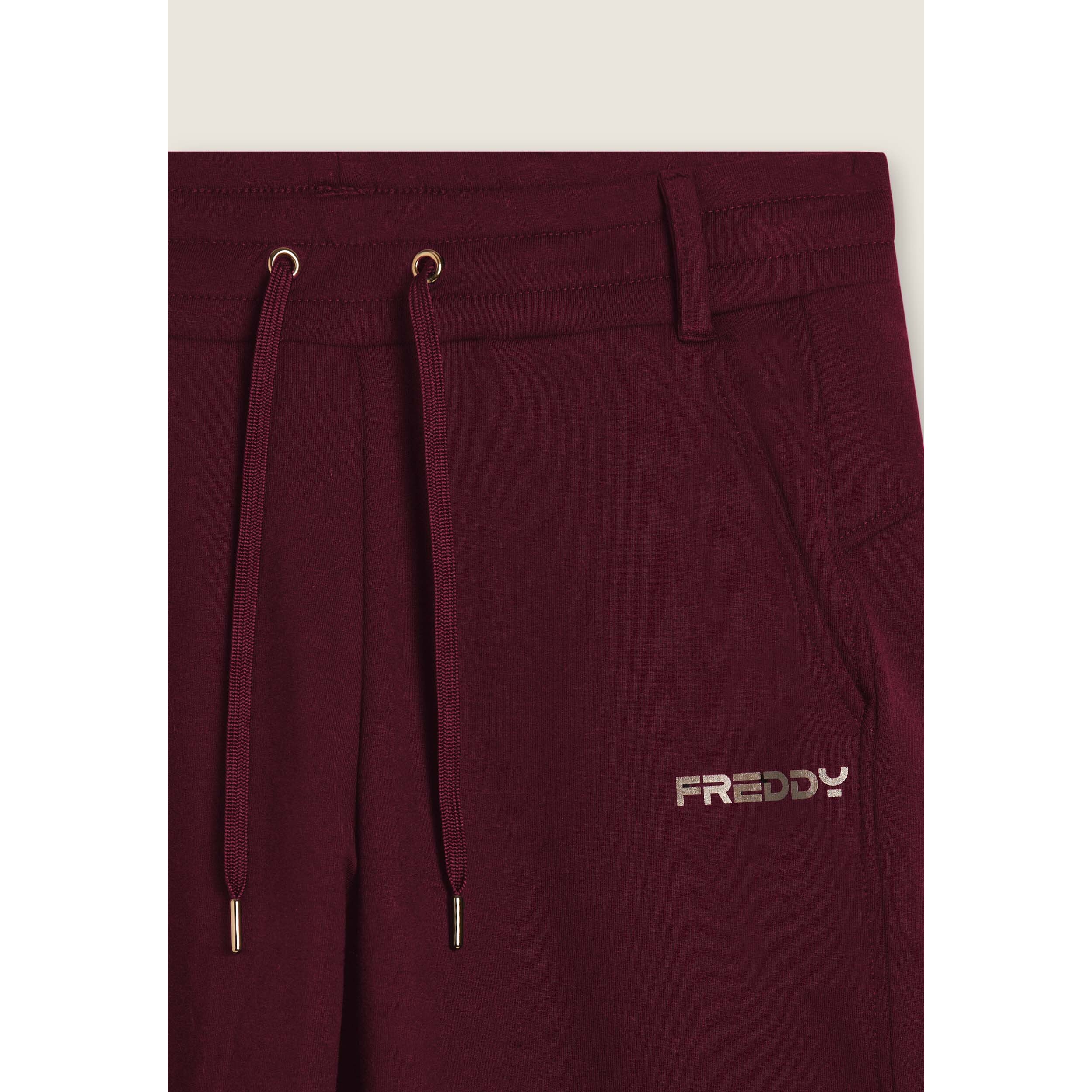 Pantaloni slim fit con spacchi laterali