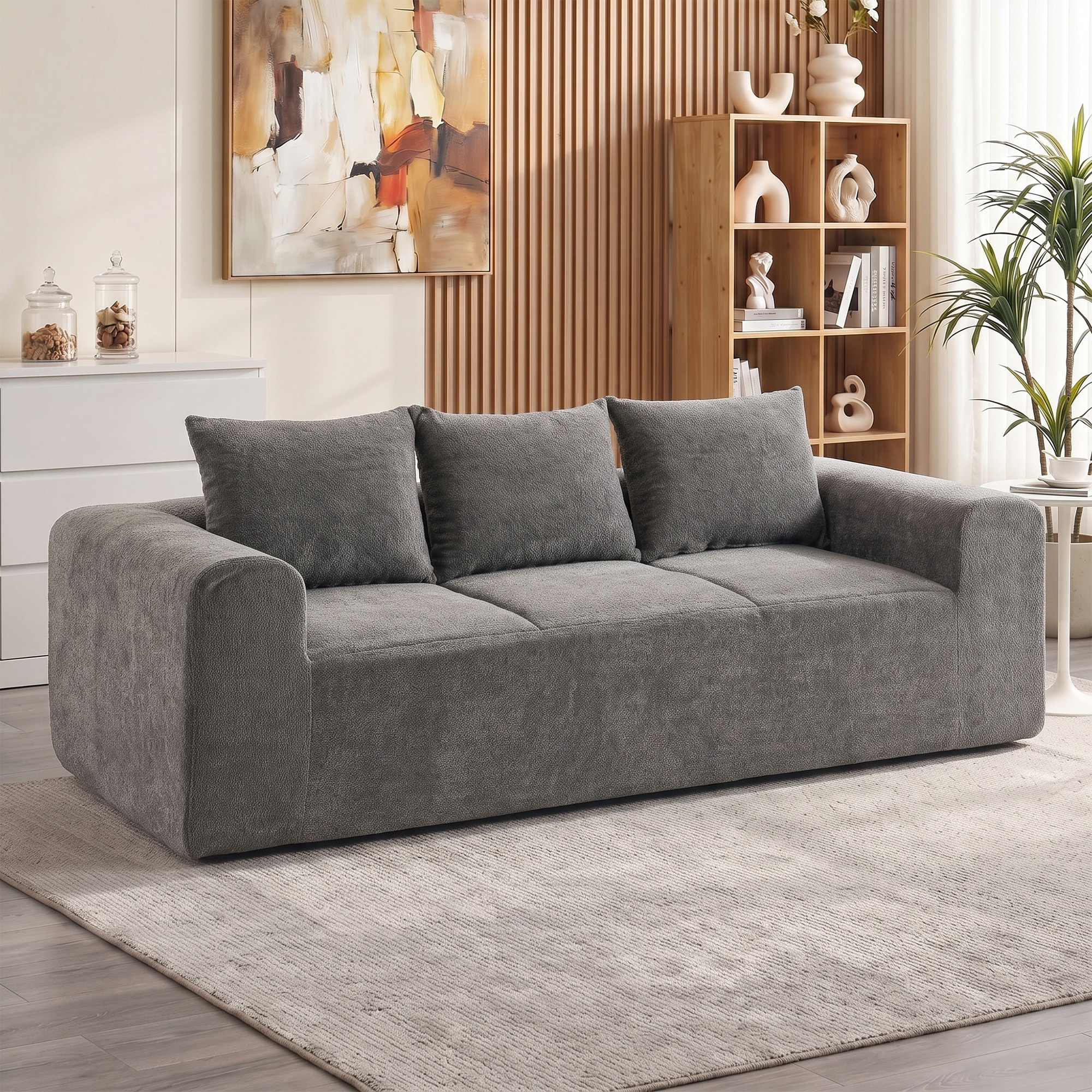Canapé design arrondi 3 places larges accoudoirs 3 coussins tissu chenille gris