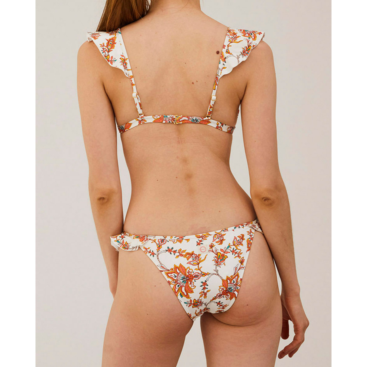 Top de bikini con volante y estampado de flores