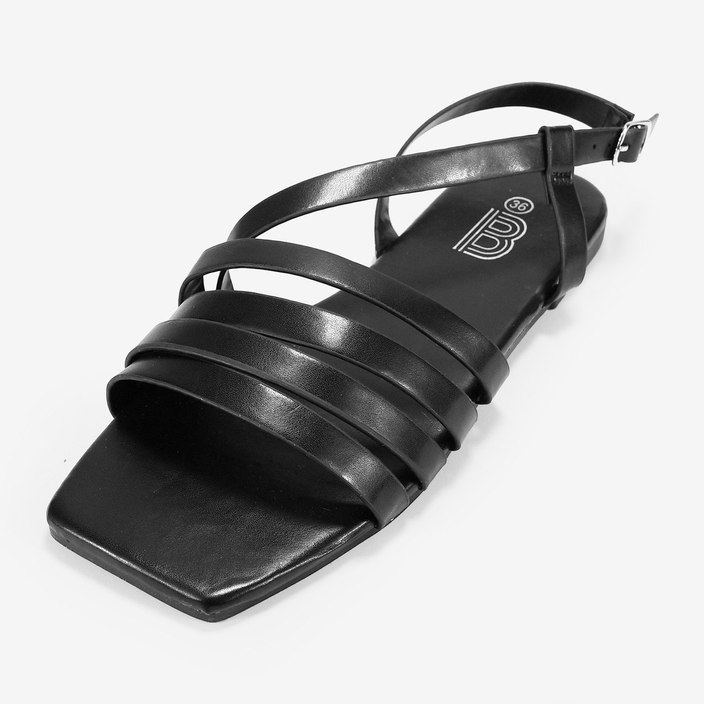 Sandalias planas negras con tiras y hebilla