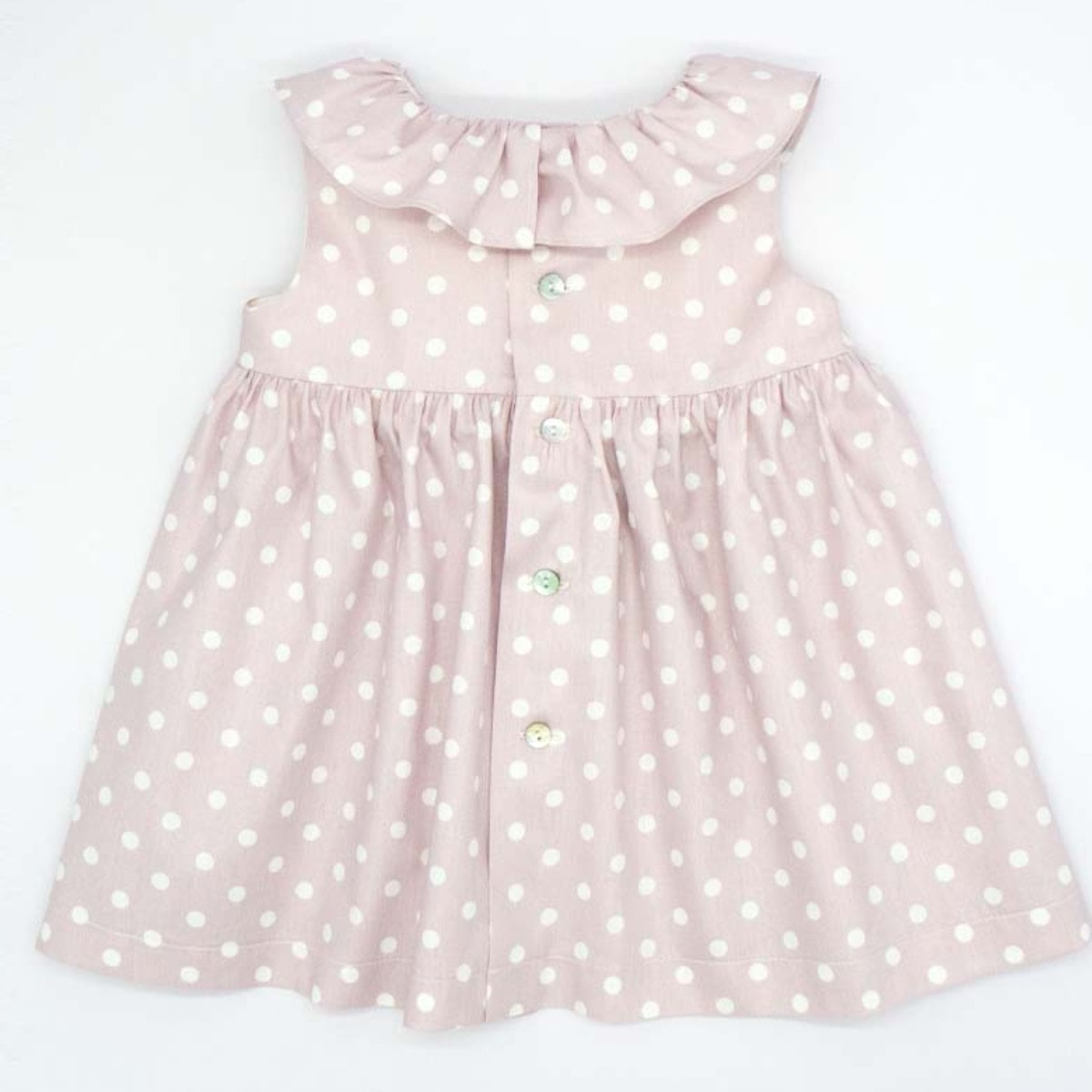 VESTIDO CON VOLANTE ROSA LUNARES BLANCO