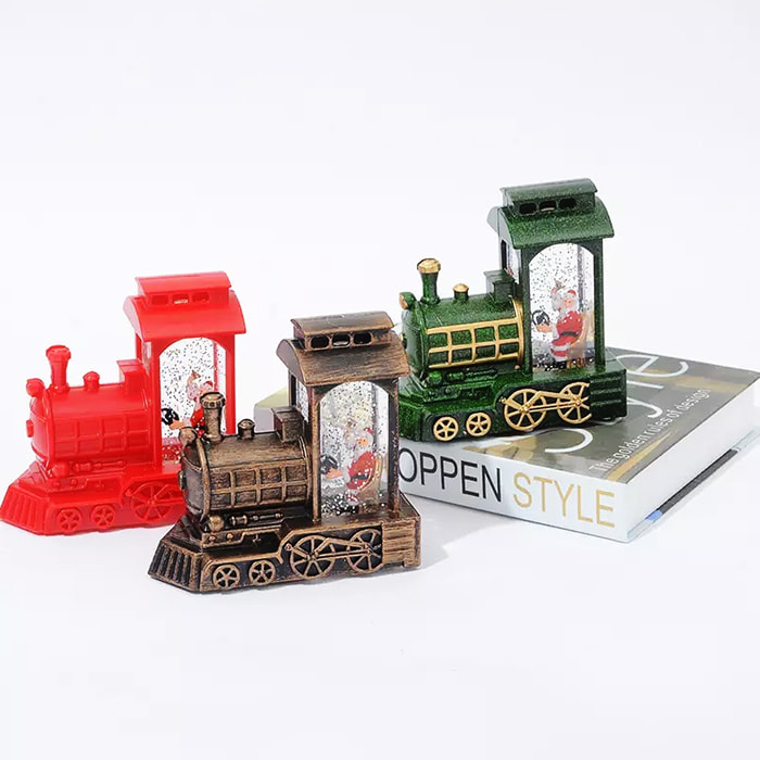 DAM Santa Claus en Tren con luz led. 12,5x6x12 Cm. Color: Verde Oscuro