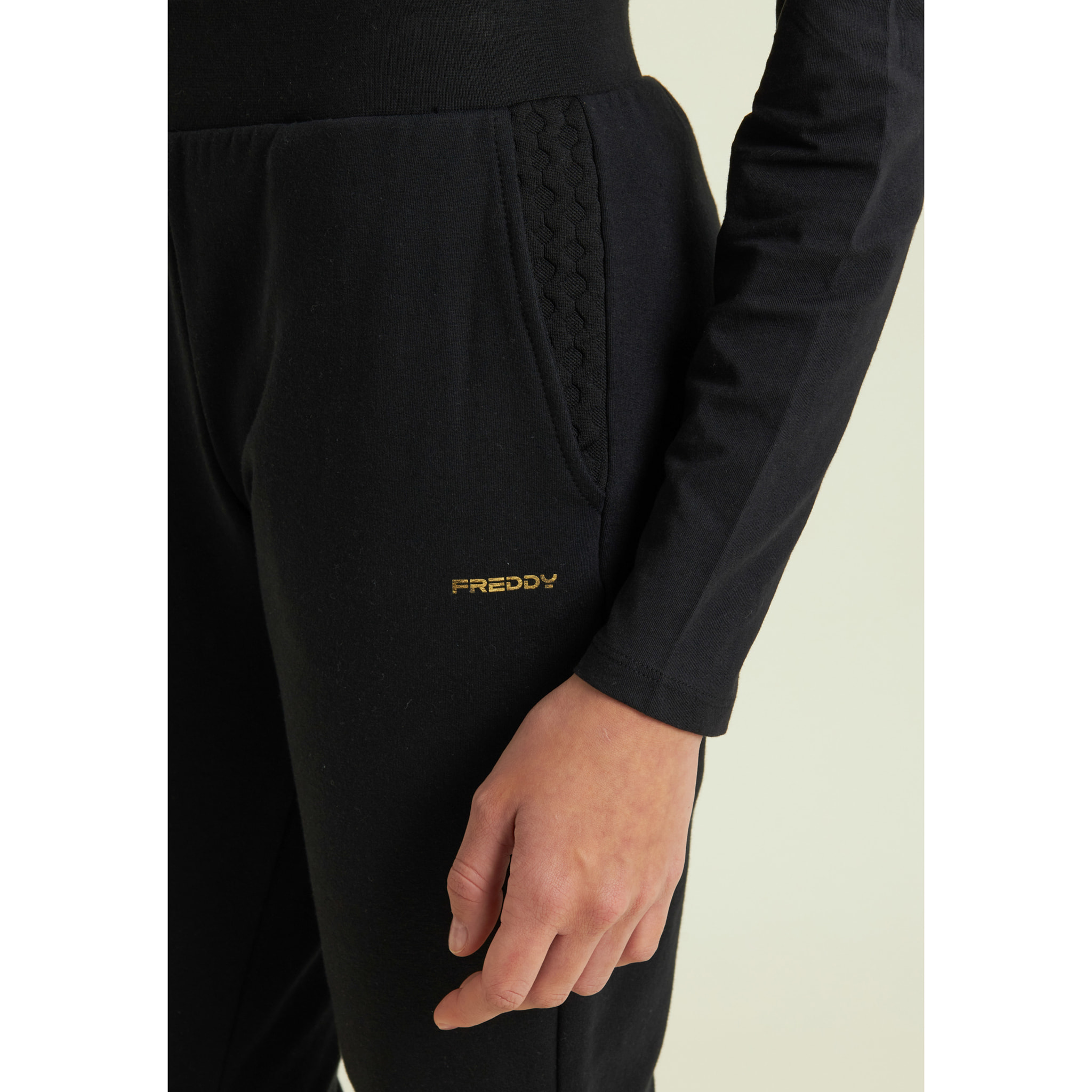 Pantaloni regular in felpa garzata con dettagli a trecce