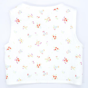 Chaleco crudo con flor roja, cinta para atar en el delantero.