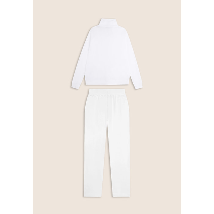 Tuta donna con zip, collo alto e spacchi laterali su fondo gamba