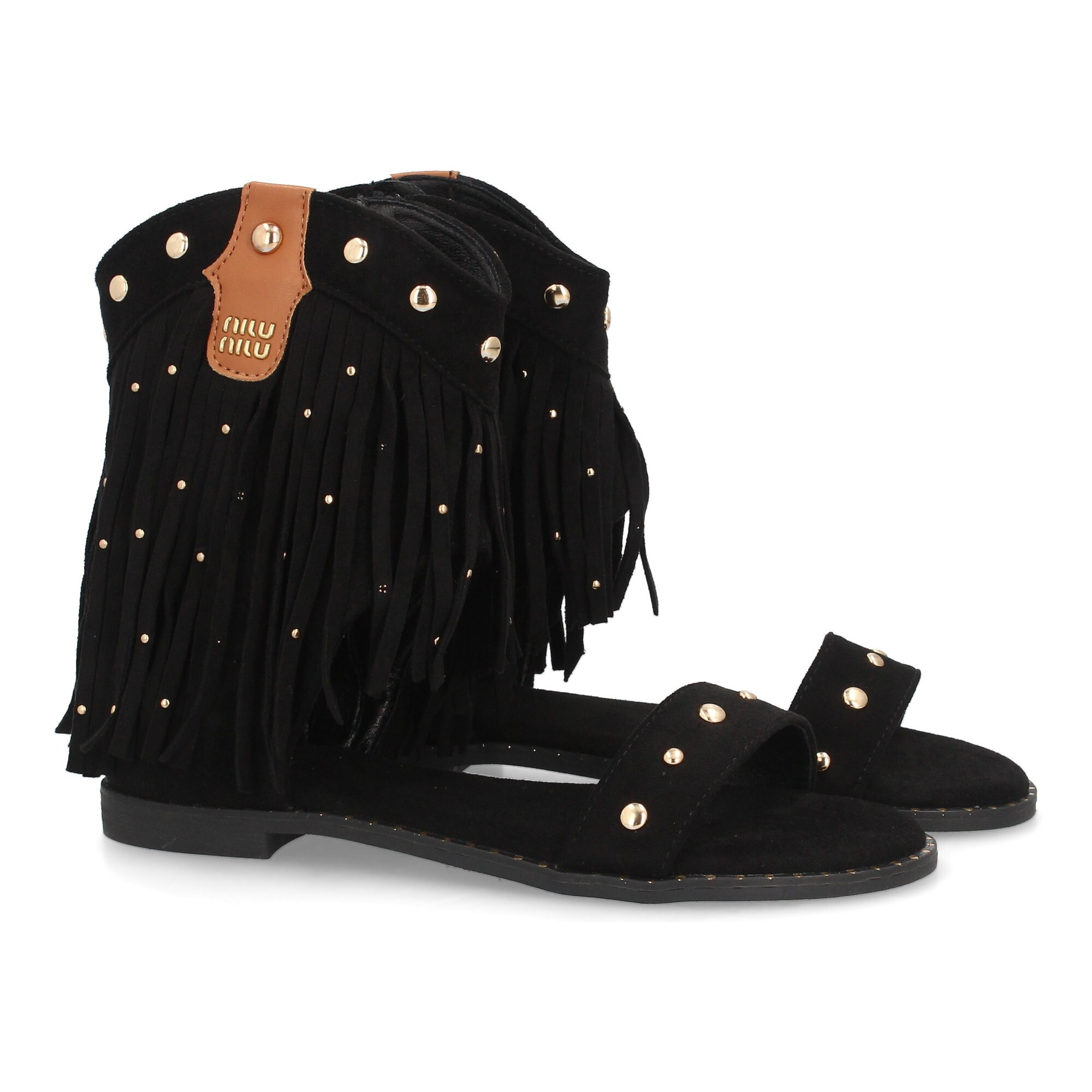 Sandalias planas con flecos y tachuelas