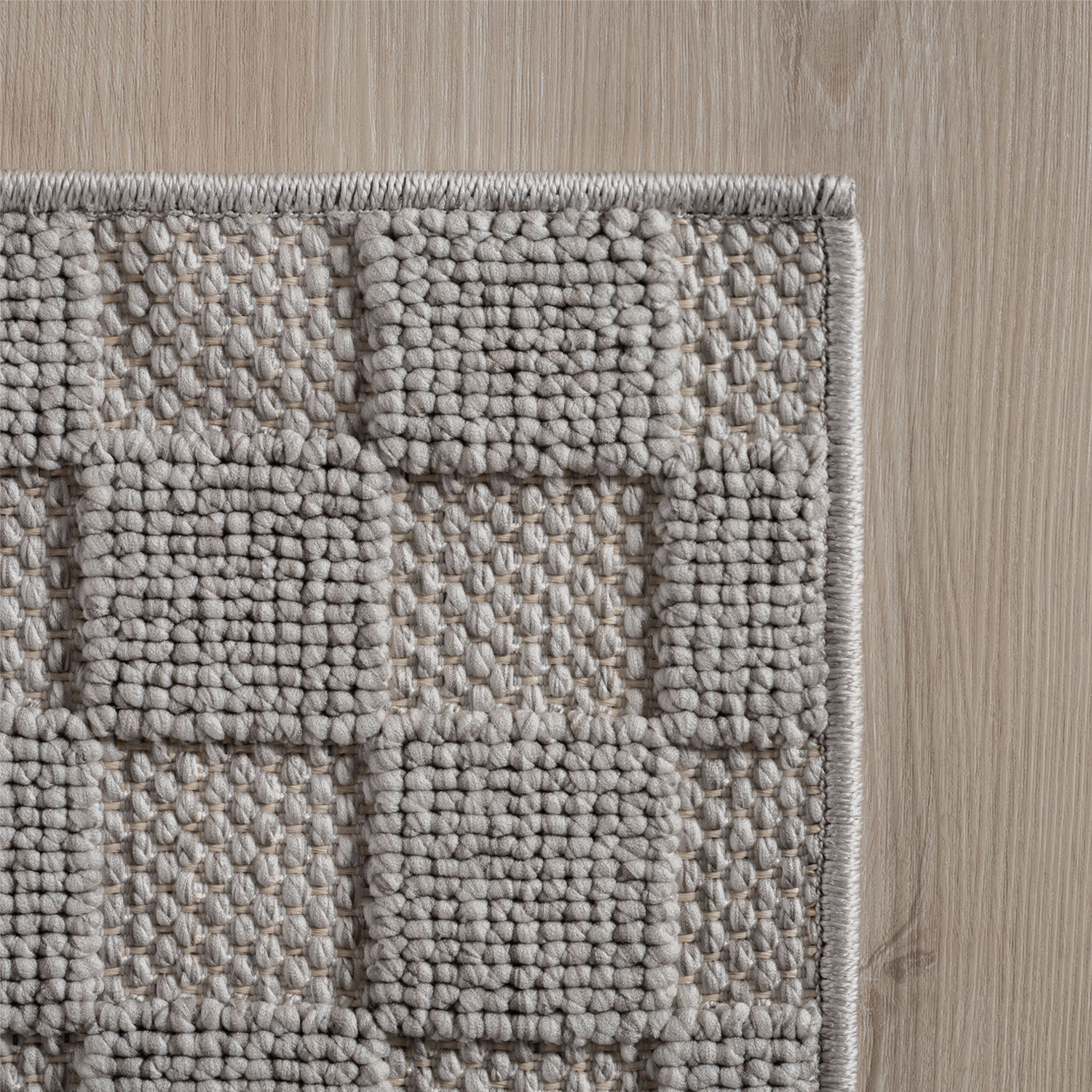 HELIX - Tapis moderne effet laine bouclé à motif damier en relief gris