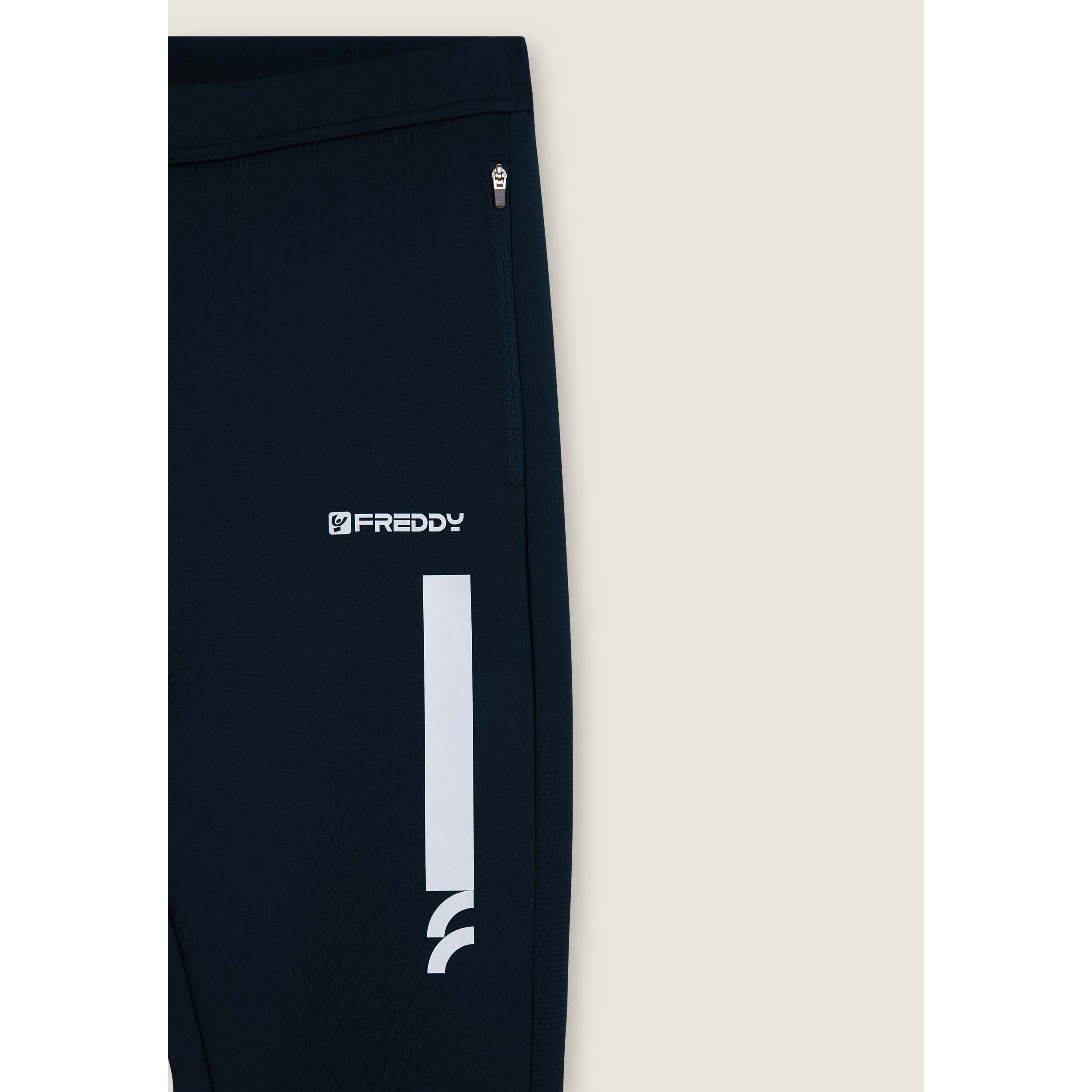 Pantaloni slim in tessuto tecnico con inserti mesh laterali