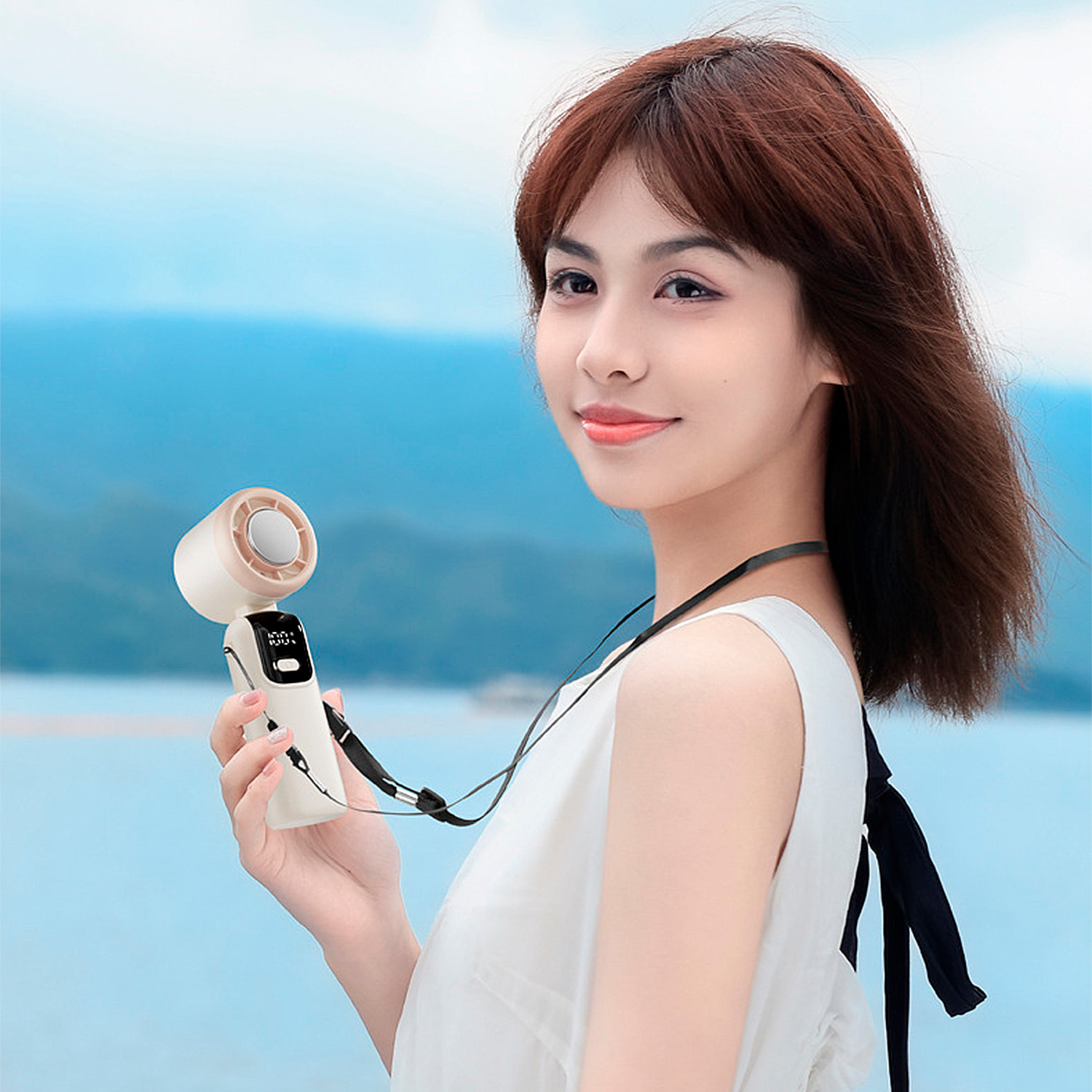 Mini ventilador de mano recargable con 5 velocidades principales y panel refrigerador.