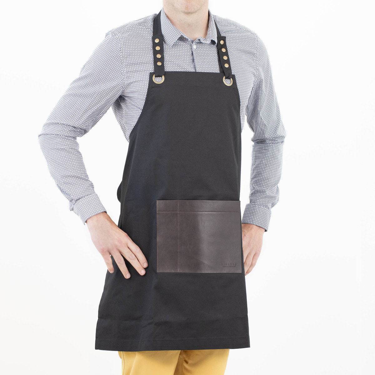 Honoré - Tablier en tissu noir avec poche en simili cuir marron