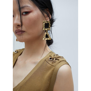 Top in maglia con occhielli