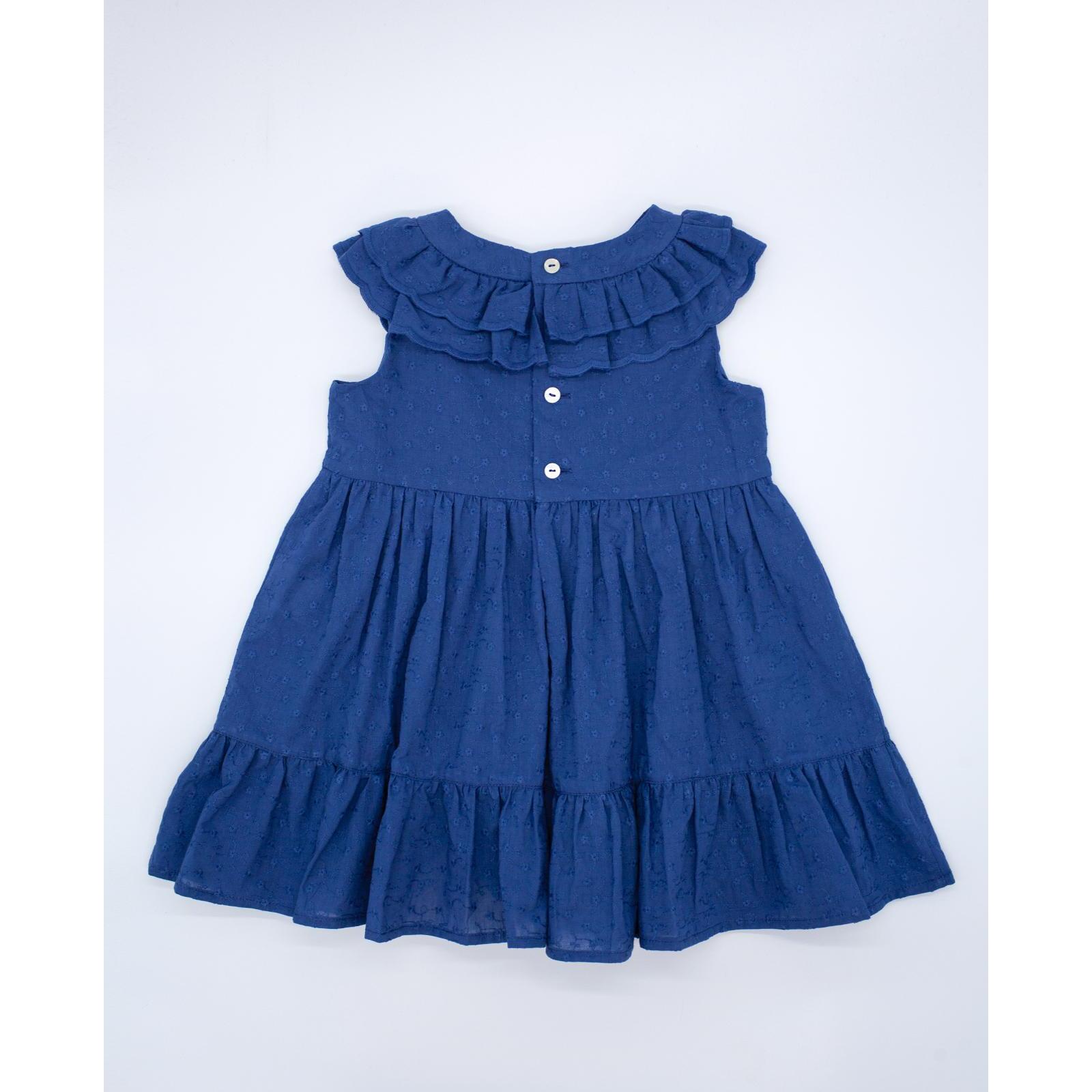 Vestido de voile bordado azul marino. De tirantes con doble volante en el cuello, falda fruncida con volante.