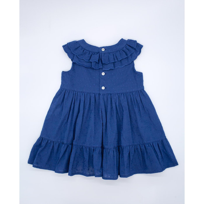 Vestido de voile bordado azul marino. De tirantes con doble volante en el cuello, falda fruncida con volante.