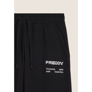 Pantaloni sportivi con bande laterali e fondo a polsino