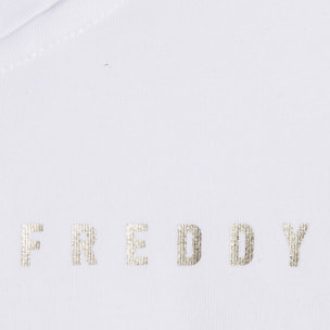 Tuta donna con zip, collo alto e spacchi laterali su fondo gamba