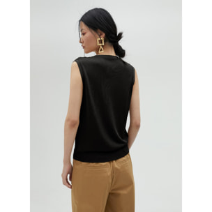 Top in maglia con occhielli