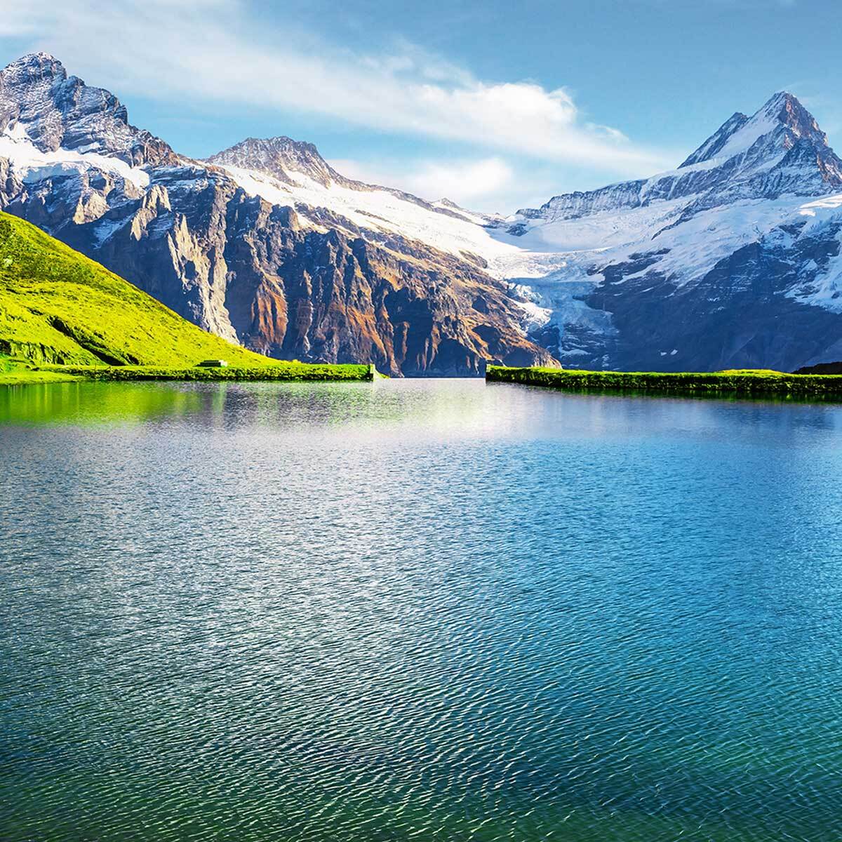 Tableau panoramique lac alpin turquoise et sommets enneigés été Toile imprimée