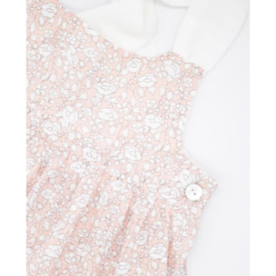 Vestido midi de flor rosa. Falda de volantes y tirantes cruzados en la espalda.