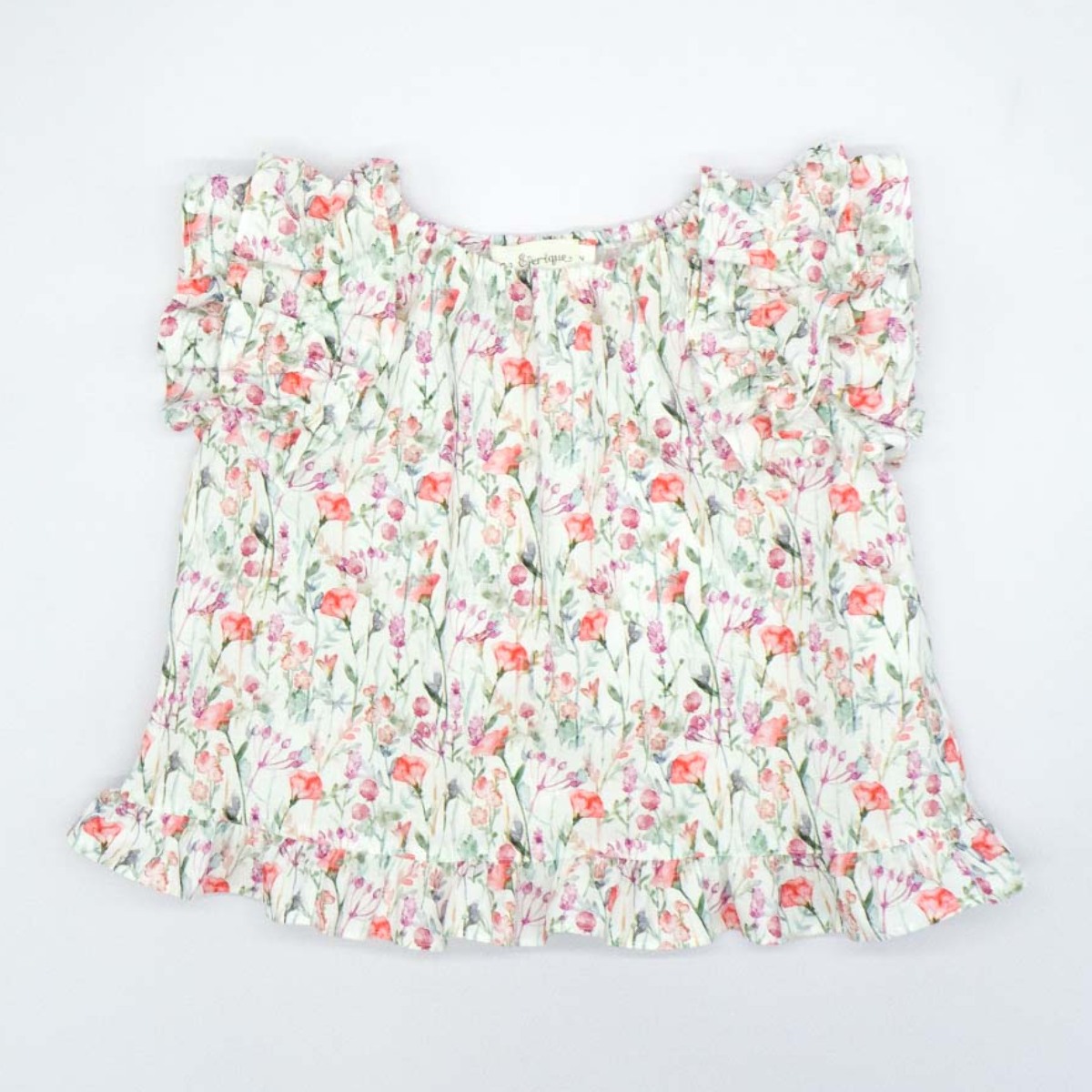BLUSA CON VOLANTES ESTAMPADA FLORES ROSA