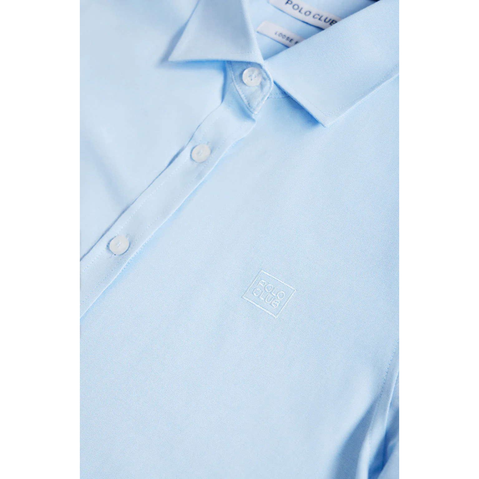 Camisa oxford azul celeste con logo bordado