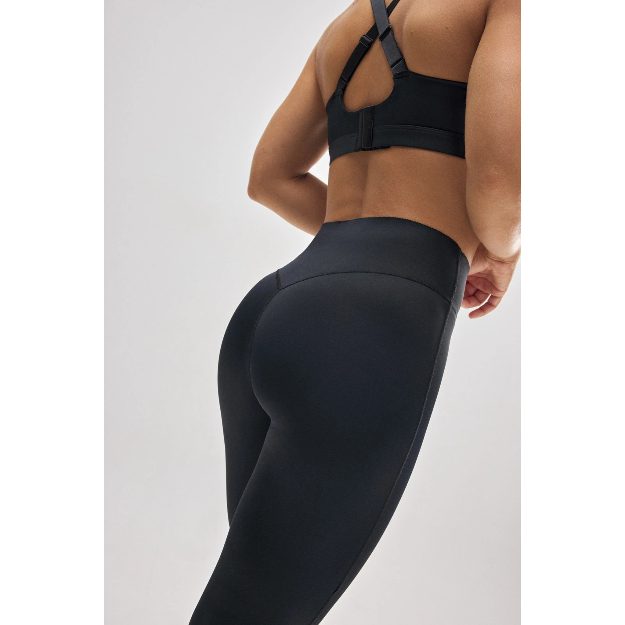 Leggings sportivi neri effetto pancia piatta